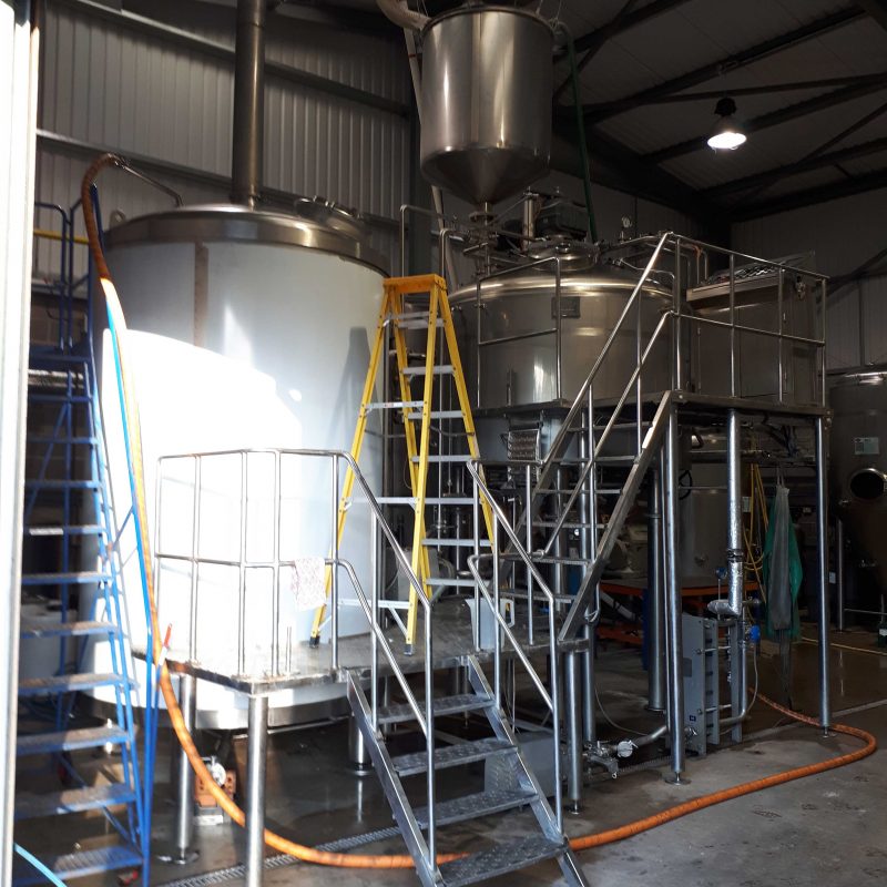 KETTLE-INSTALLATION-AT-DORSET-BREWING-COMPANY-SITE-WORK-SERVICE-WORK-BEVERAGE-INDUSTRY-measuring-up-for-new-pipework-on-the-kettle